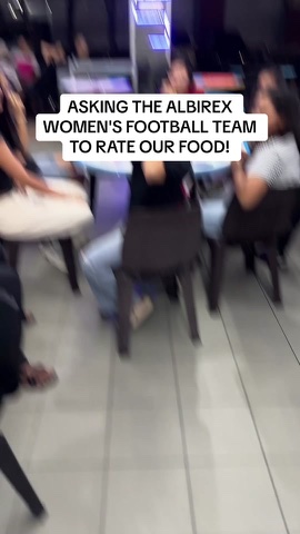 Albirex women's football team rating the food at the stall